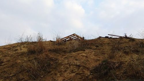 Old ruin on field against sky