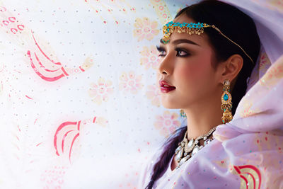 Close-up of young woman wearing sari