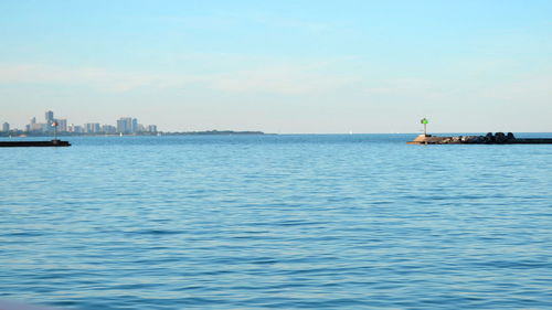 Sailboat sailing on sea against sky
