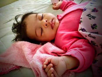 Cute baby sleeping on bed