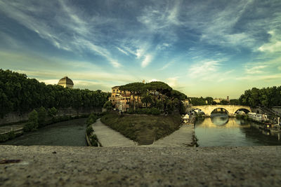 Scenic view of river against sky during sunset