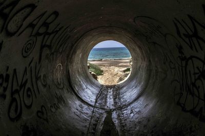 View of sea seen through window