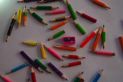 High angle view of colored pencils on table