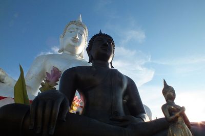 Low angle view of statue against sky