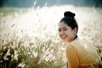 Portrait of smiling woman on field