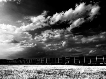 Scenic view of white and black agriculture field against sky