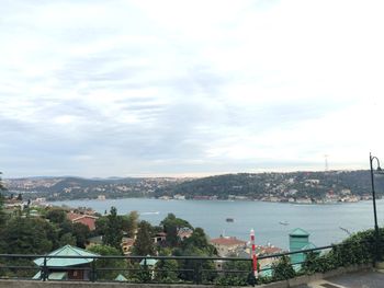 View of harbor against cloudy sky