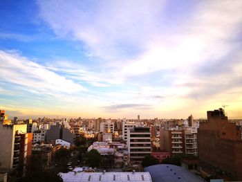 Cityscape against sky during sunset