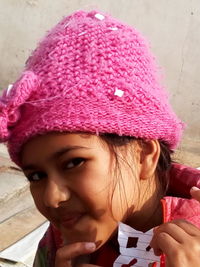 Portrait of cute girl with pink hat