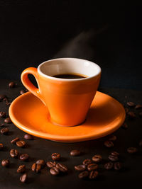 Close-up of coffee cup on table