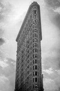 Low angle view of building against cloudy sky