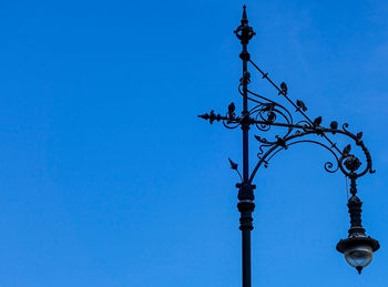 Low angle view of street light against clear sky