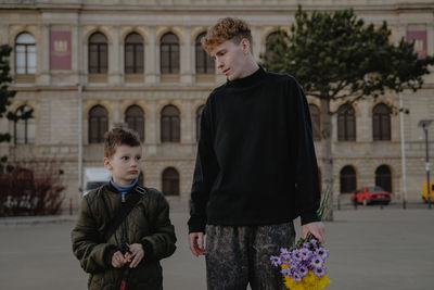 Portrait of boy standing on street