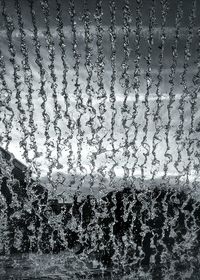 Close-up of water drops on glass window