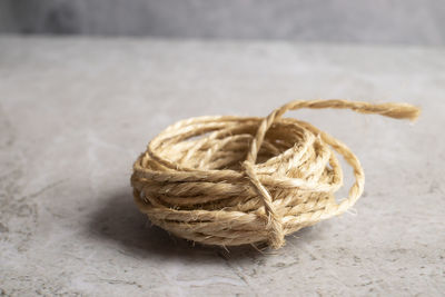 Close-up of rope tied on table