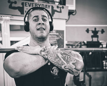 Low angle view of young man standing in gym