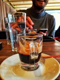 Close-up of beer glass on table at restaurant