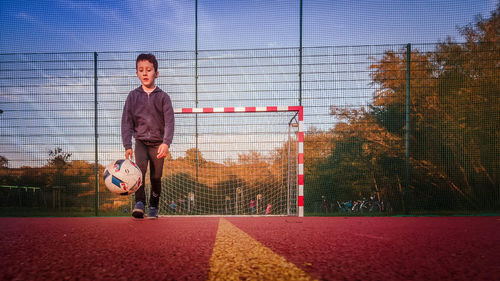 Man playing soccer ball on field