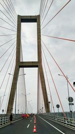 Suspension bridge against sky in city