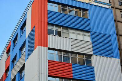 Low angle view of building against blue sky