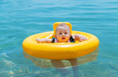 Portrait of boy swimming in lake