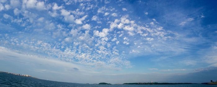 Scenic view of sea against blue sky