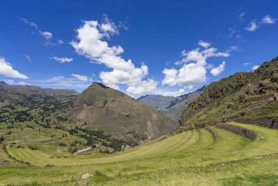 Scenic view of landscape and mountains against sky