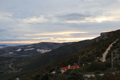 Scenic view of townscape against sky during sunset