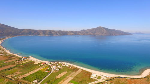 Scenic view of sea against clear blue sky