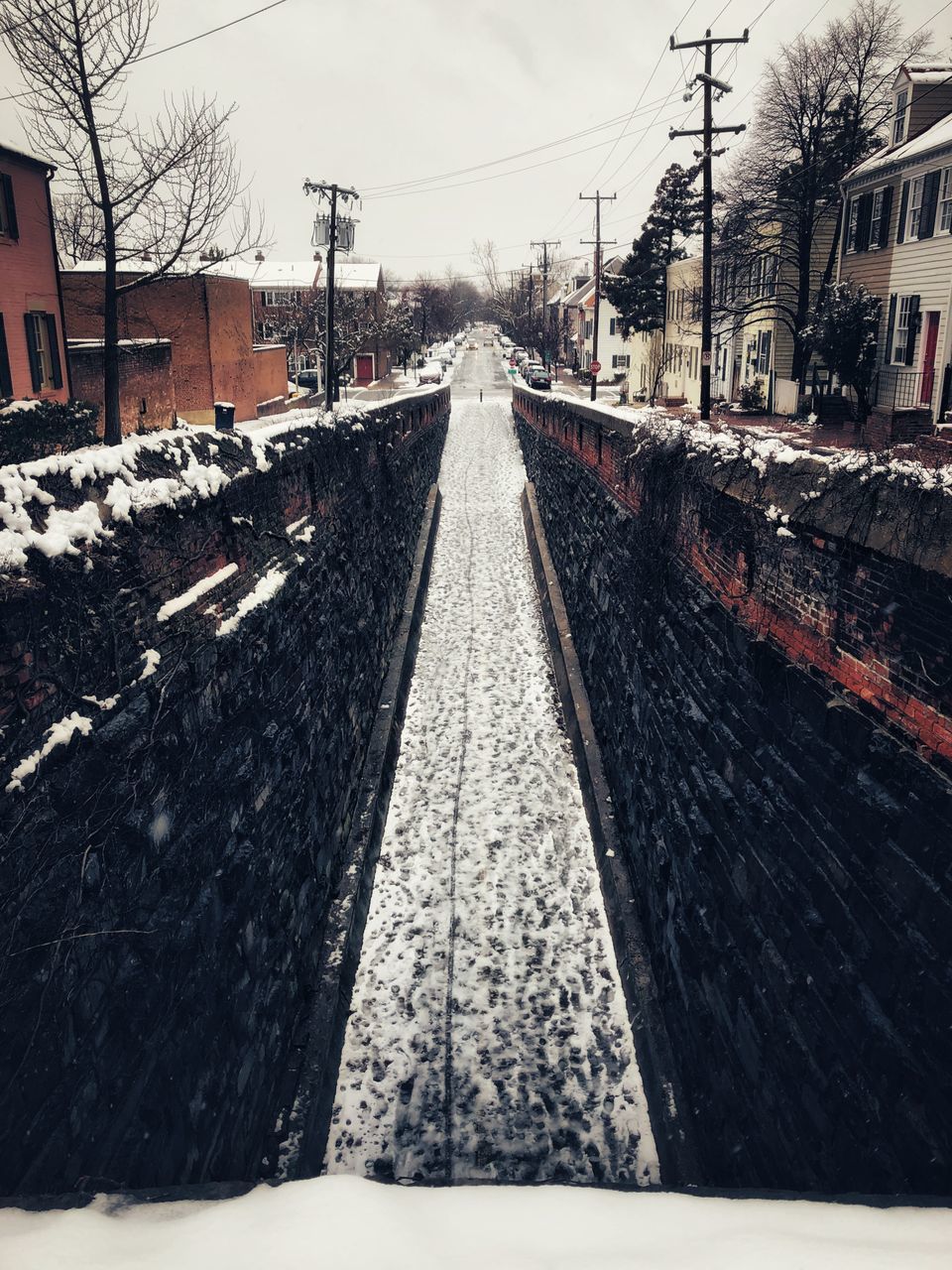 VIEW OF RAILROAD TRACKS DURING WINTER