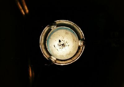 High angle view of illuminated lamp against black background