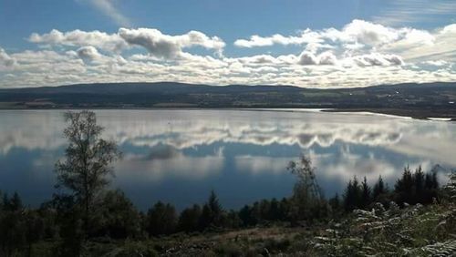 Scenic view of lake with mountains in background