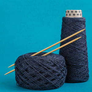 Close-up of black coffee on table against blue background