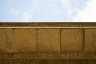 Low angle view of wall against sky