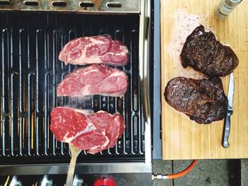 High angle view of steak on barbecue