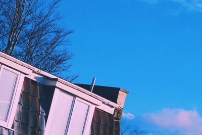Low angle view of building against blue sky