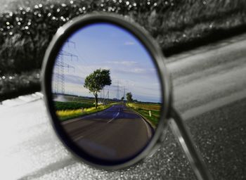 Reflection of road on side-view mirror
