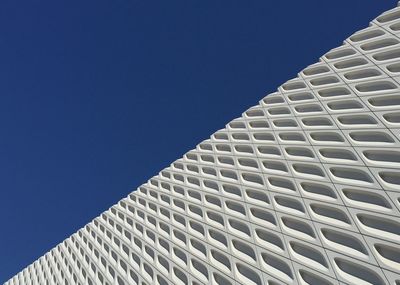 Low angle view of building against clear blue sky