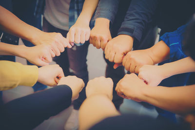 Rear view of people hands