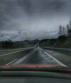 Highway seen through car windshield