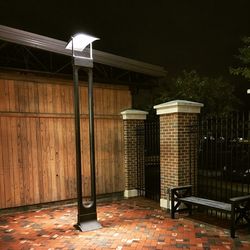 Illuminated lamp post at night