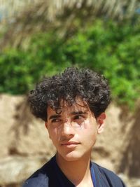 Close-up of young man looking away