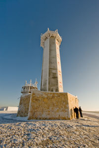 Low angle view of built structure against clear blue sky