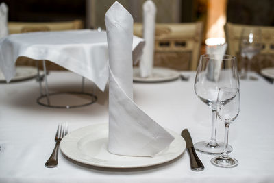 Drinking glasses on table in restaurant