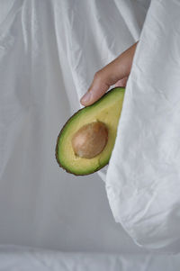 Close-up of woman holding fruit