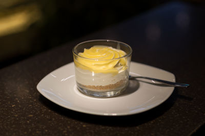 Close-up of lemon cheesecake on table