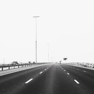 Empty road against clear sky