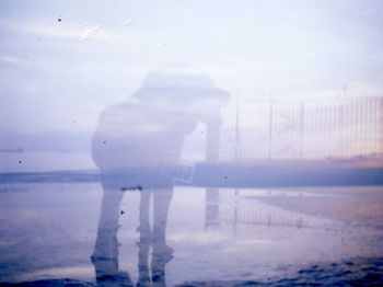 Reflection of woman in water