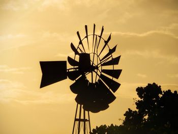 Low angle view of ferris wheel against sky