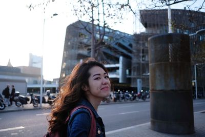 Portrait of beautiful woman in city